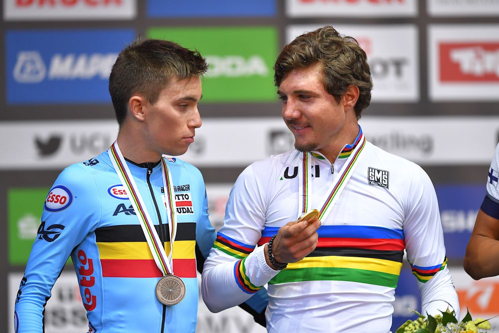 Bjorg Lambrecht and Marc Hirschi on the U23 road race podium