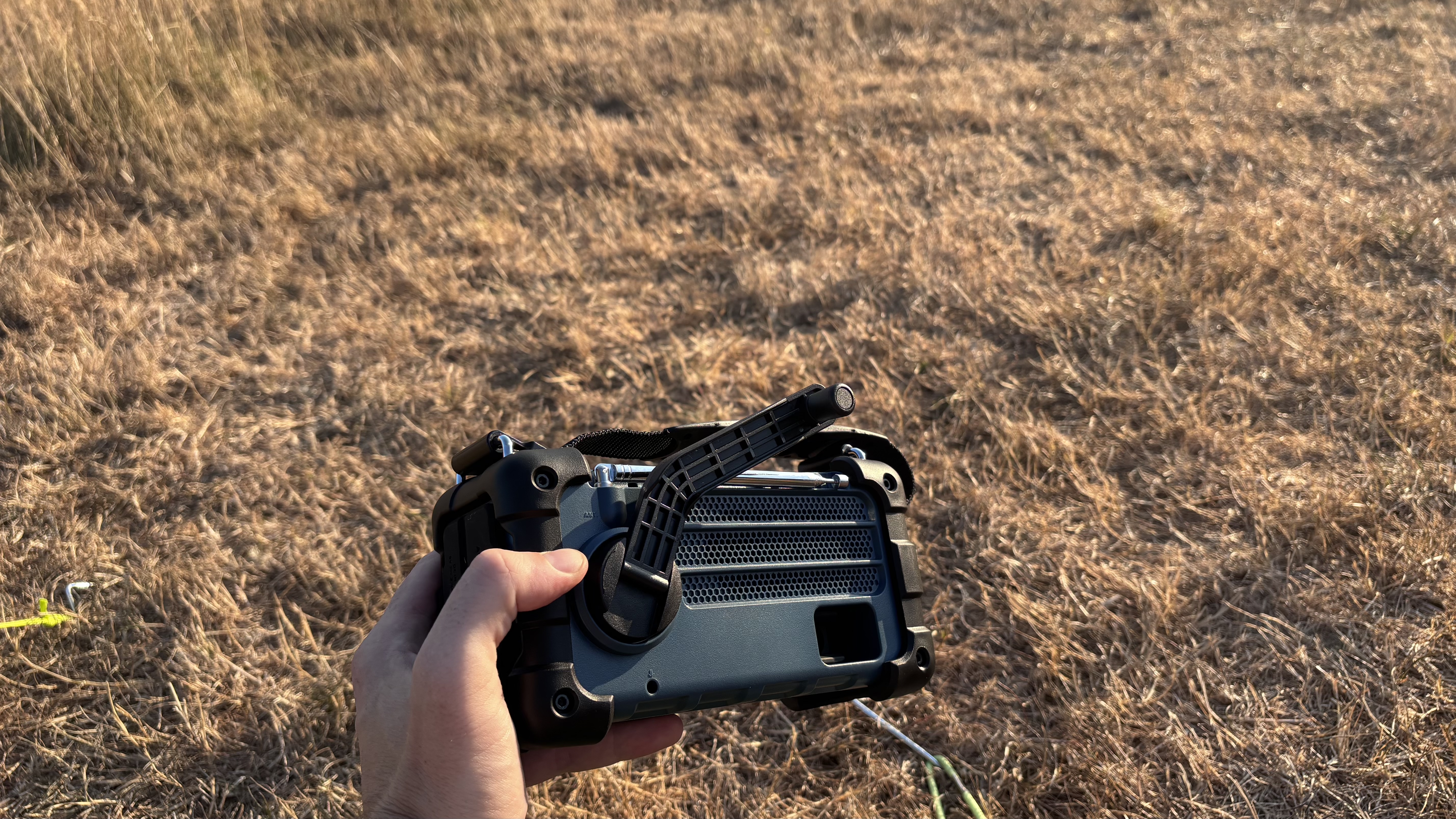 Roberts SolarDAB 99 radio with hand crank in field