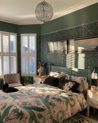 Green bedroom with patterned bedding