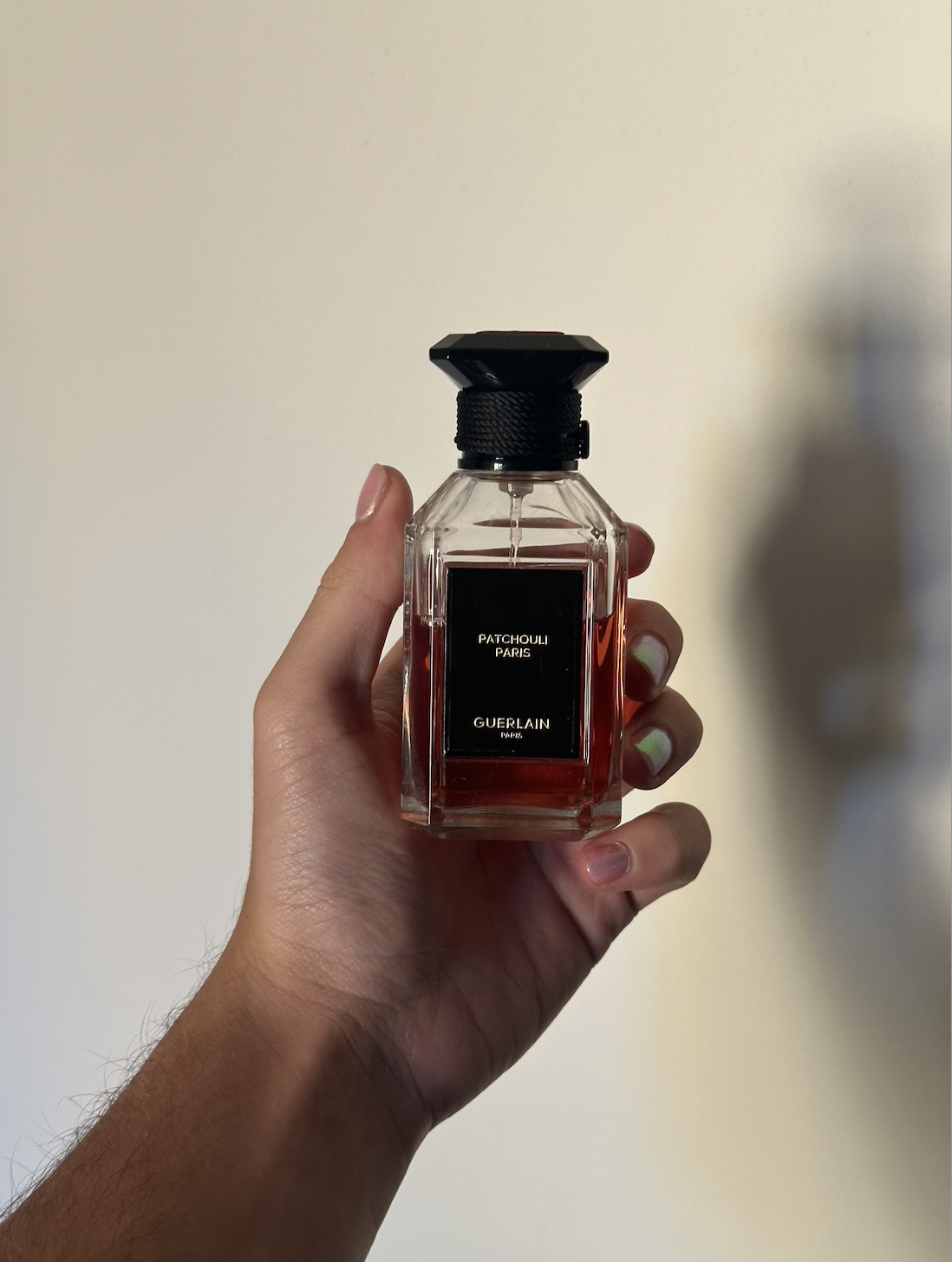 David Evan Ruff holding Guerlain's Fev&amp;eacute; Gourmande