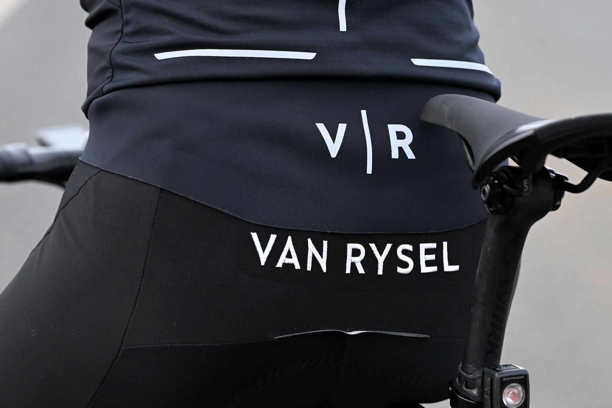 Close up of the Van Rysel embroidered branding on the lower back of the bib tights