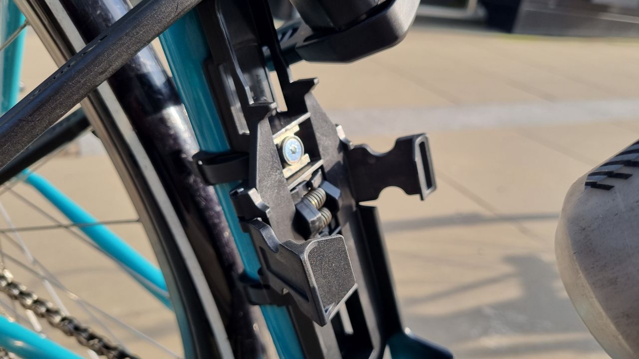 A close up of the bracket of the Abus Bordo 6200K lock, mounted to a bike