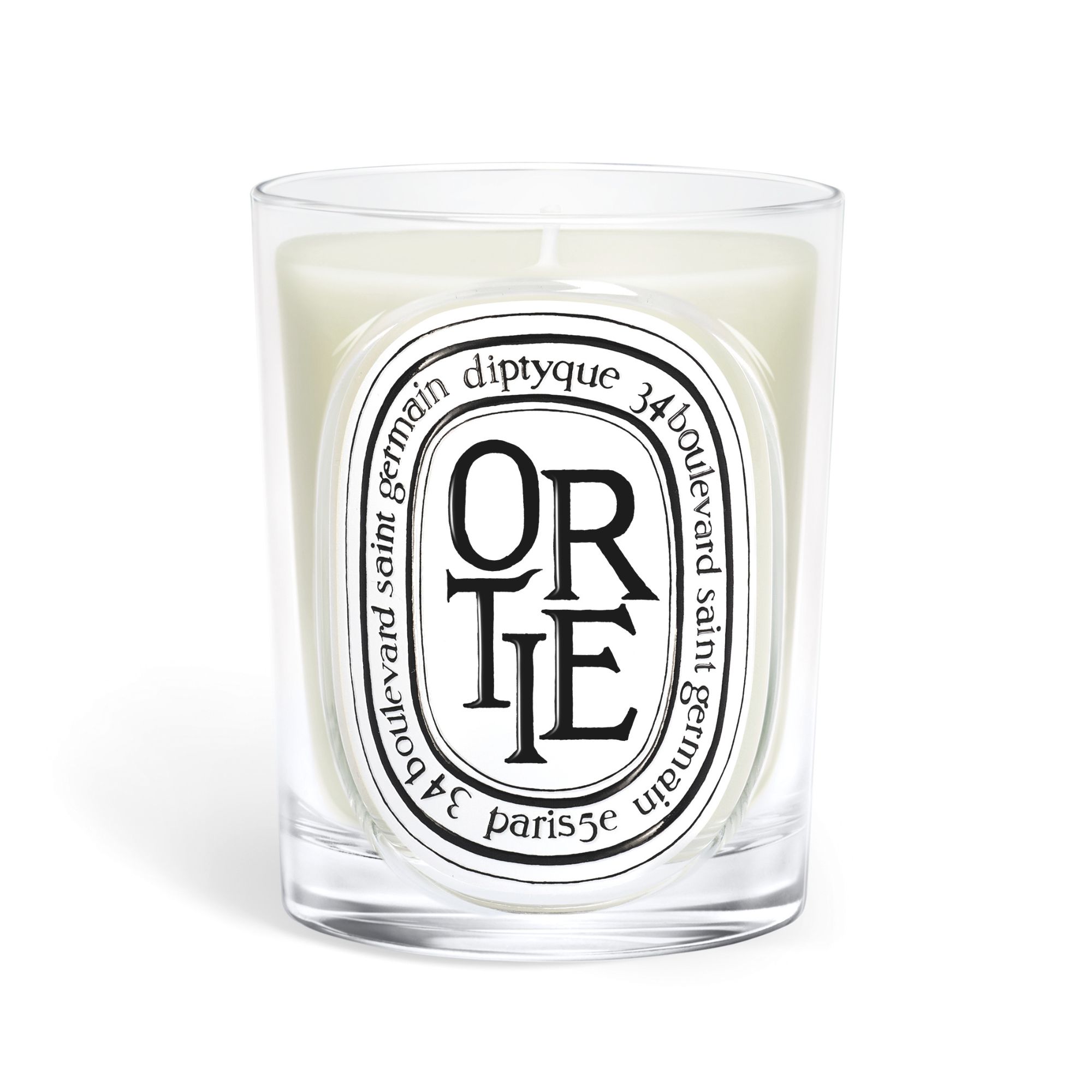 One of the new Diptyque candles, the ortie, on a white background