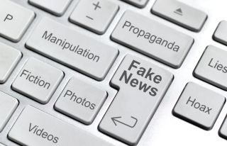 Fact-checking sites keyboard with fake news keys