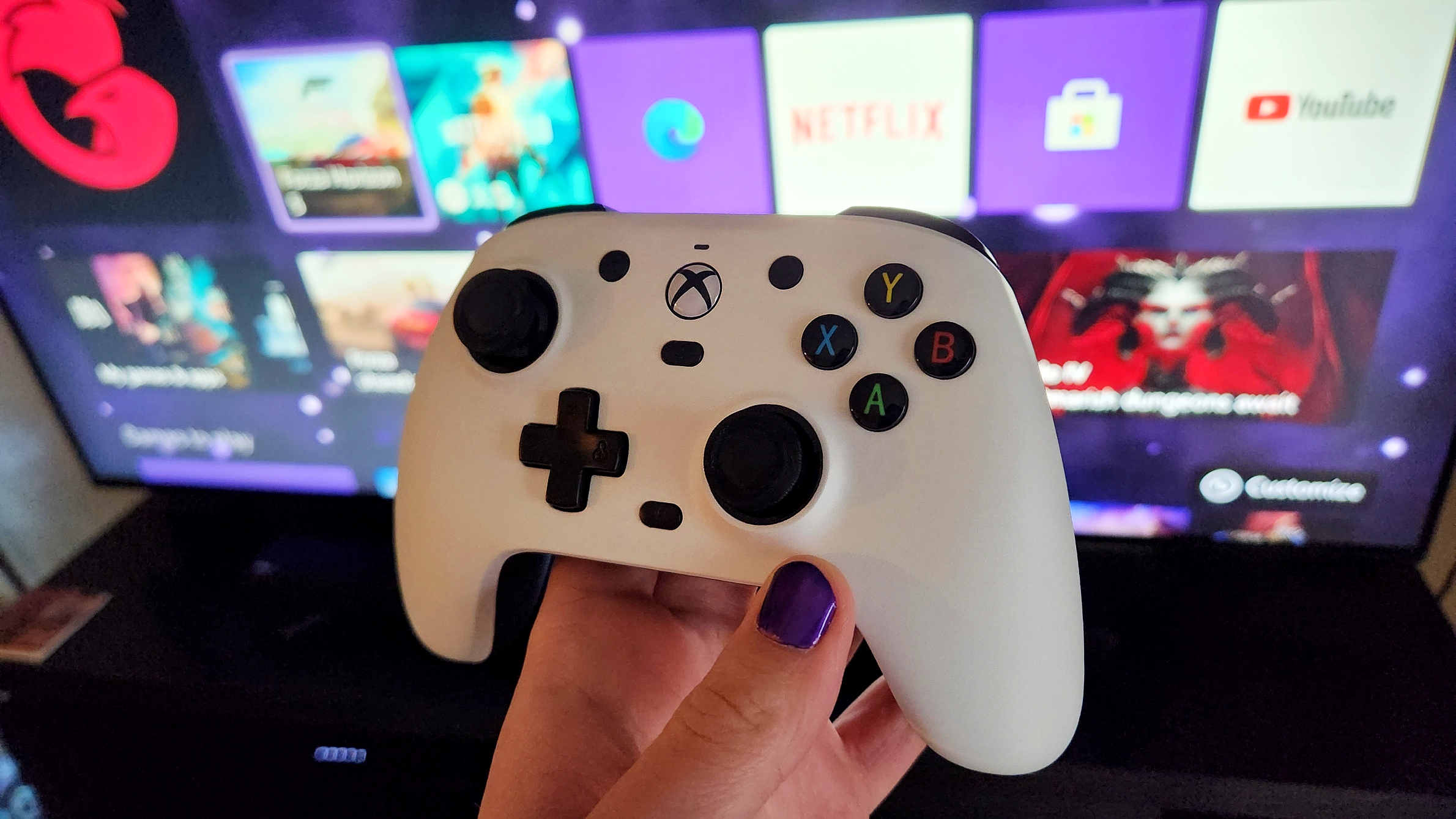 GameSir G7 Wired Controller, in white, in front of the Xbox Series X Dashboard.