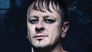 Korn’s Ray Luzier posing for a photograph in 2016