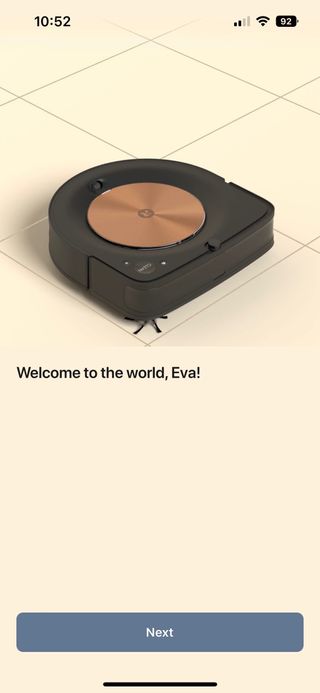 A screenshot of setting up the Roomba s9+ in the app. The app shows an image of the vacuum and the text "welcome to the world, Eva!"