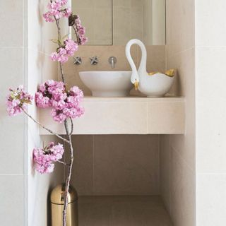 bathroom with white wall and basin