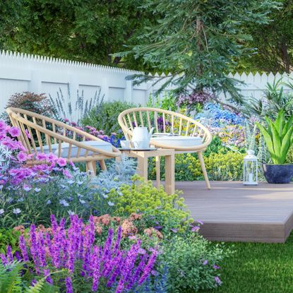 decking styled as an outdoor living room area in a modern garden