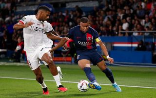 Jean-Clair Todibo tries to stop Kylian Mbappe dribbling through the Nice defence