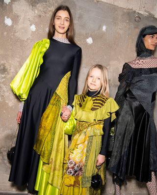 Paris women’s fashion week with black and yellow dresses