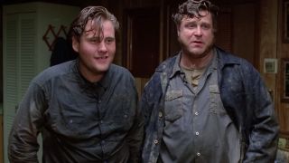 William Forsythe and John Goodman in Raising Arizona, covered in mud.