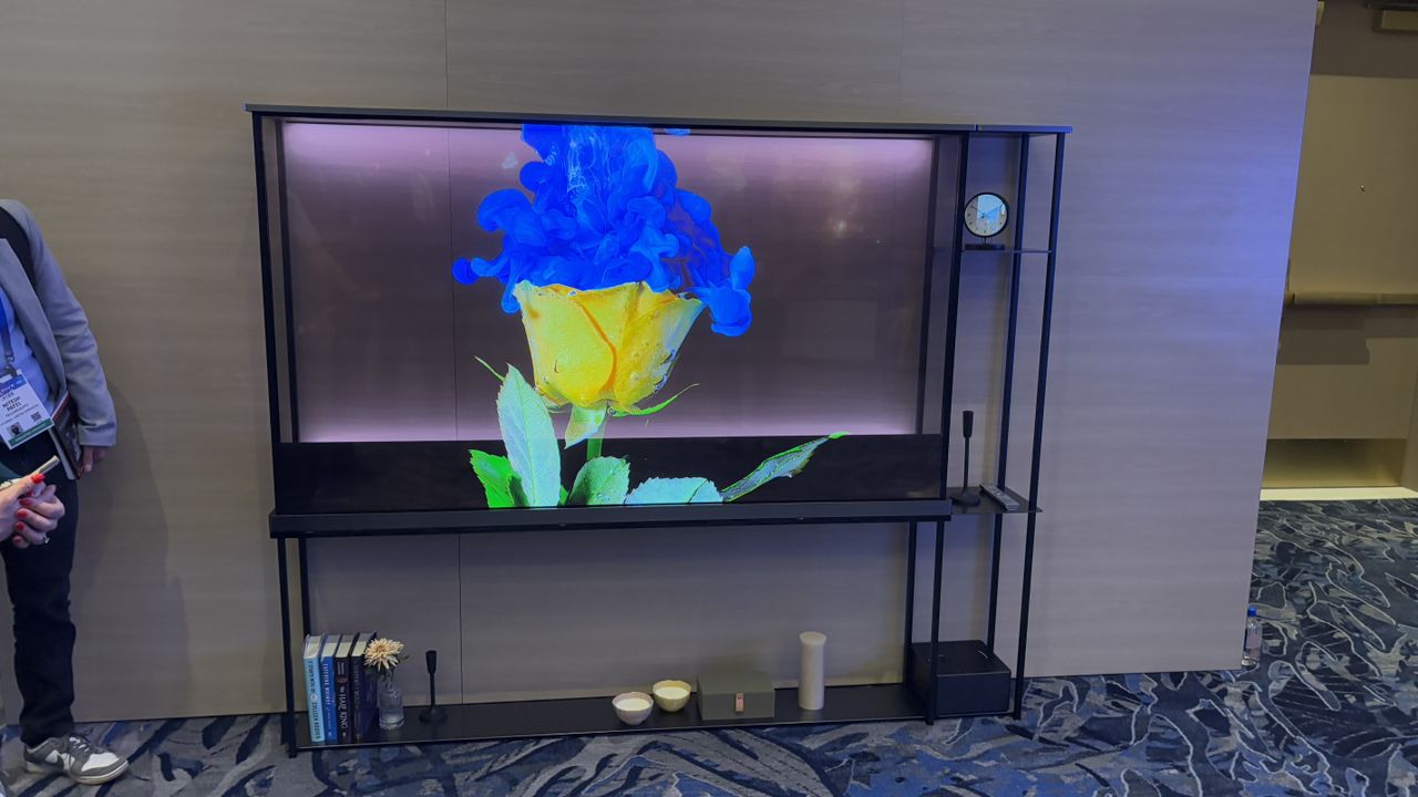 LG OLED T transparent TV against a wooden wall background