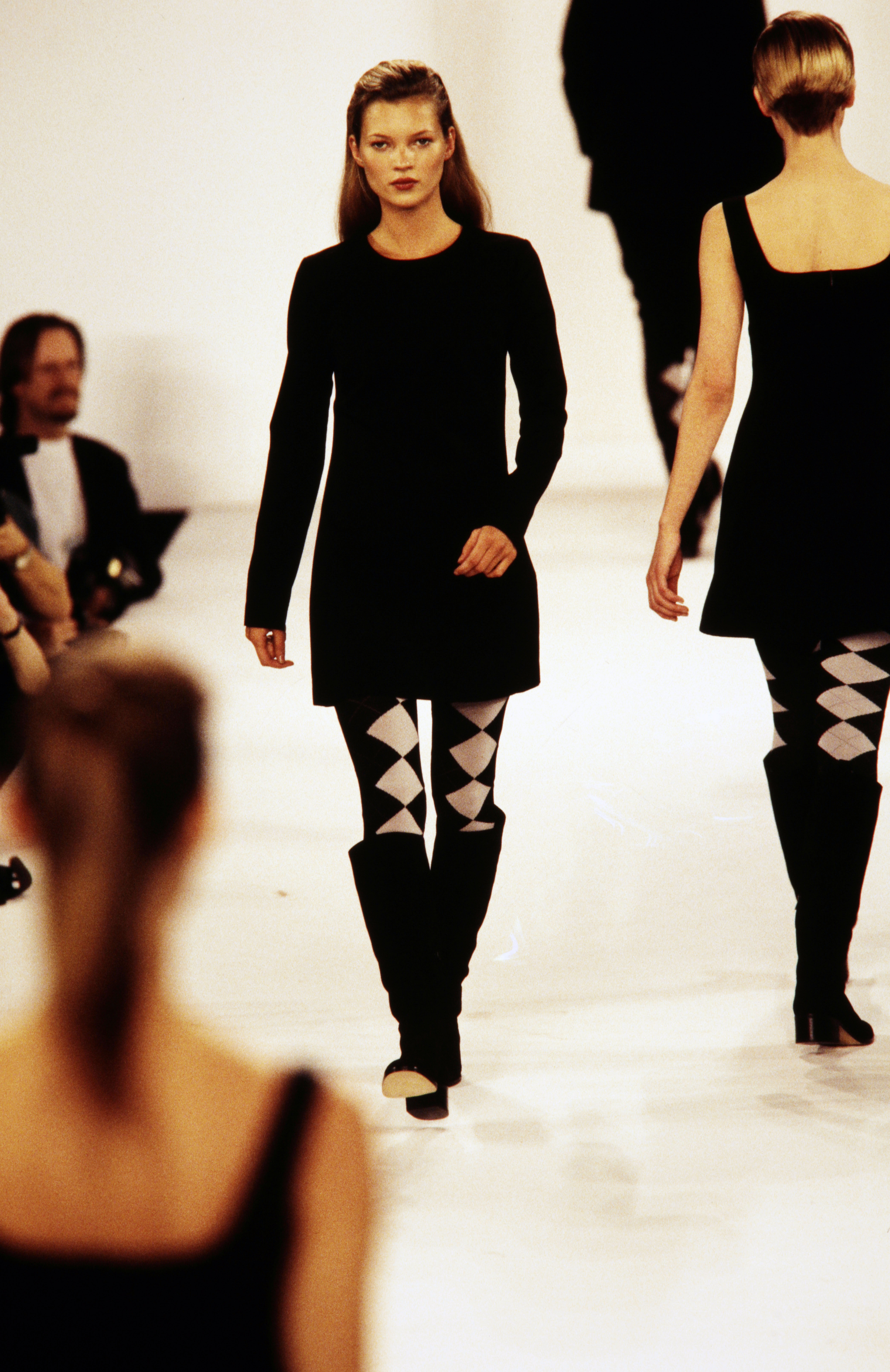 Model Kate Moss walks in the CK Calvin Klein Fall 1994 Ready to Wear Runway Show on April 10, 1994, in New York City.