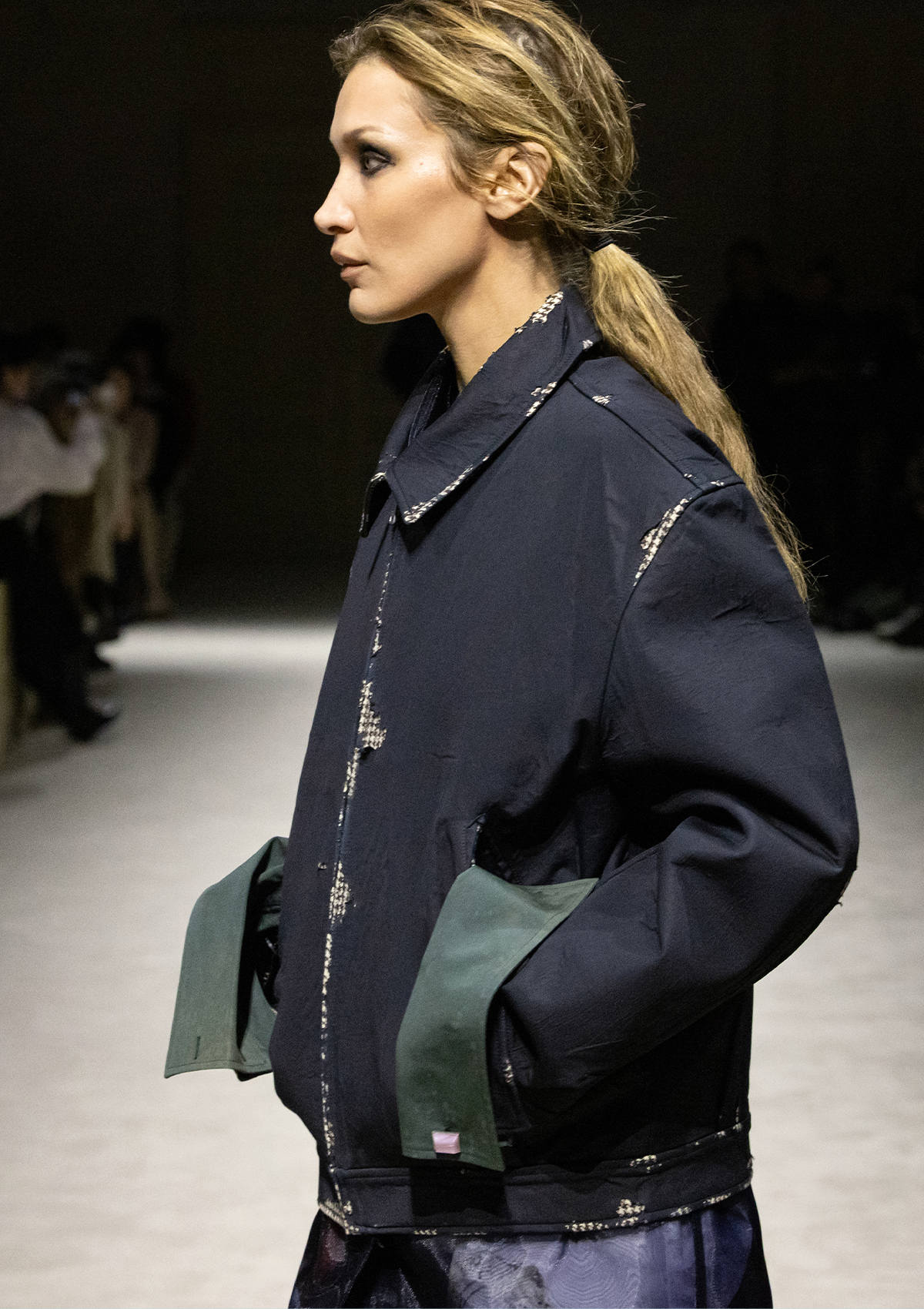 Bella Hadid wearing the jacket in the Prada F/W 26 runway show.