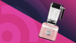 Pink KitchenAid blender on purple background