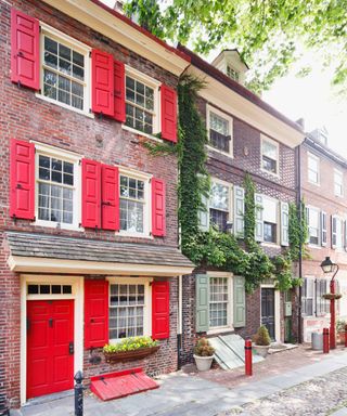 Georgian brick townhouses with red and green shutters