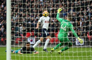 Harry Kane, centre, chips Fraser Forster for his third and Spurs' fifth