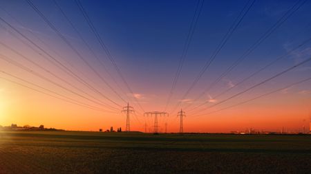 Power cables stretching out in front of the horizon