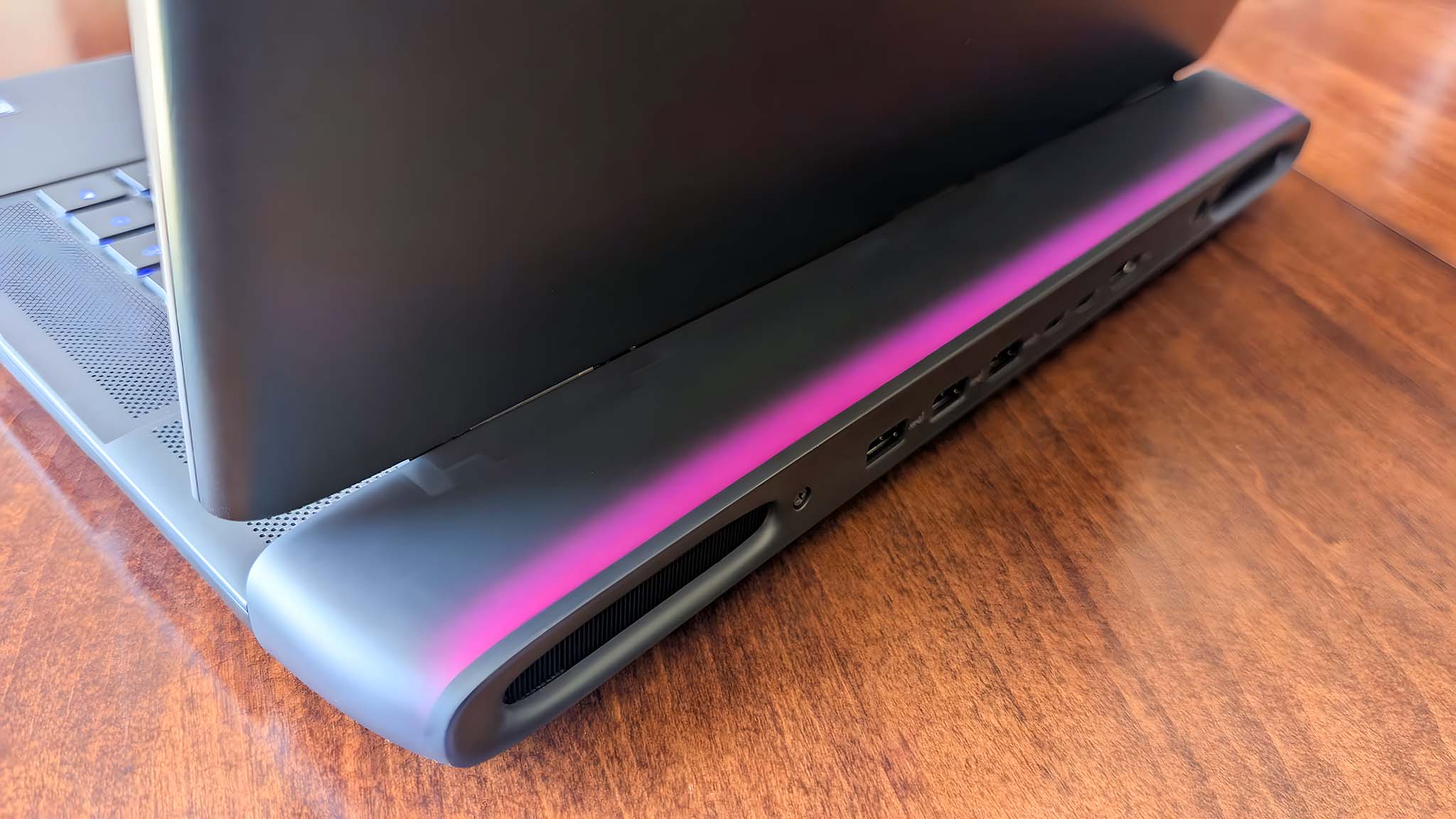 Alienware Area-51 16 Gaming Laptop thermal shelf with pink RGB lighting.