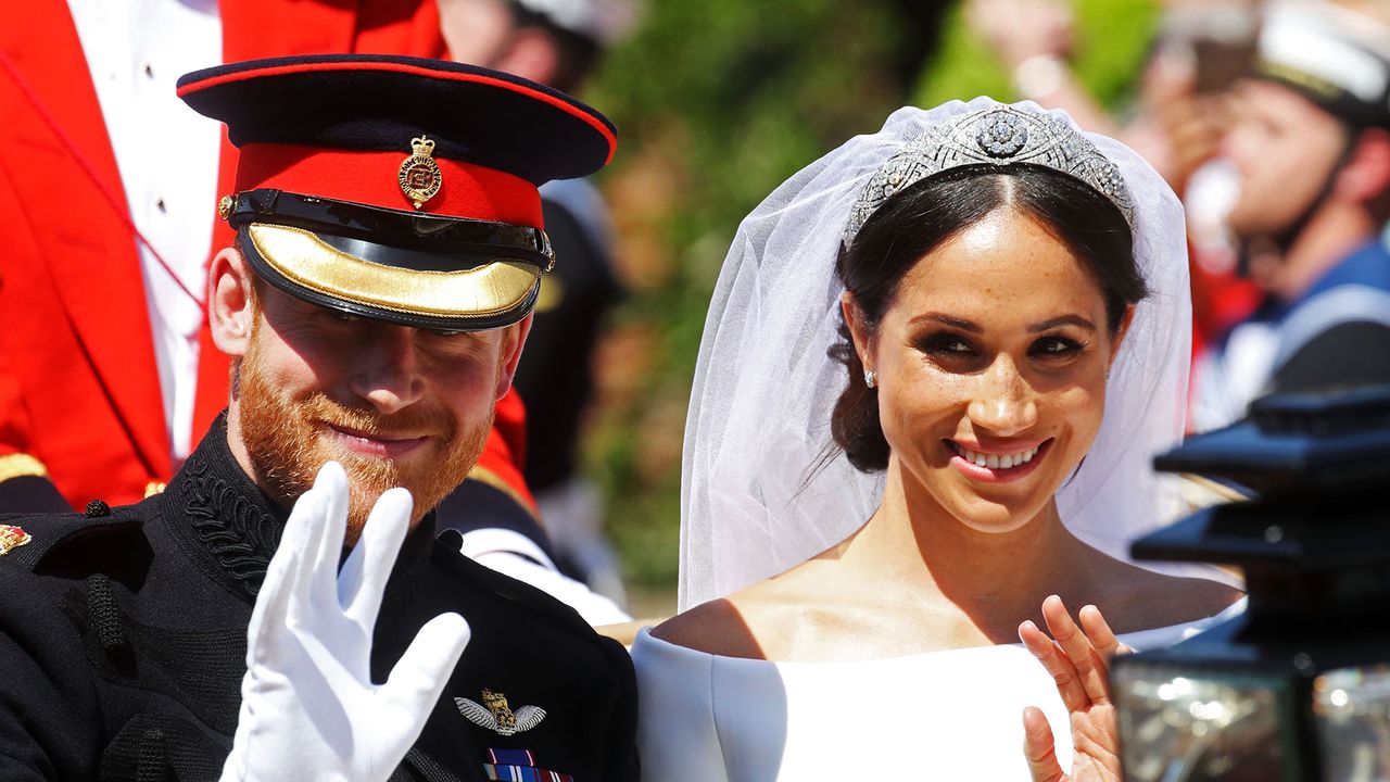 Meghan, Duchess of Sussex begins her carriage procession with Britain&#039;s Prince Harry, Duke of Sussex in the Ascot Landau Carriage after their wedding ceremony at St George&#039;s Chapel, Windsor Castle, in Windsor, on May 19, 2018