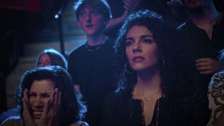 Rose Bianco as Rosa, Vanessa Rubio as Carmen in the crowd at the seikai taikai looking nervous in cobra kai season 6