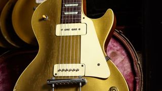 1952 Gibson Les Paul Goldtop pictured in a vintage guitar case.