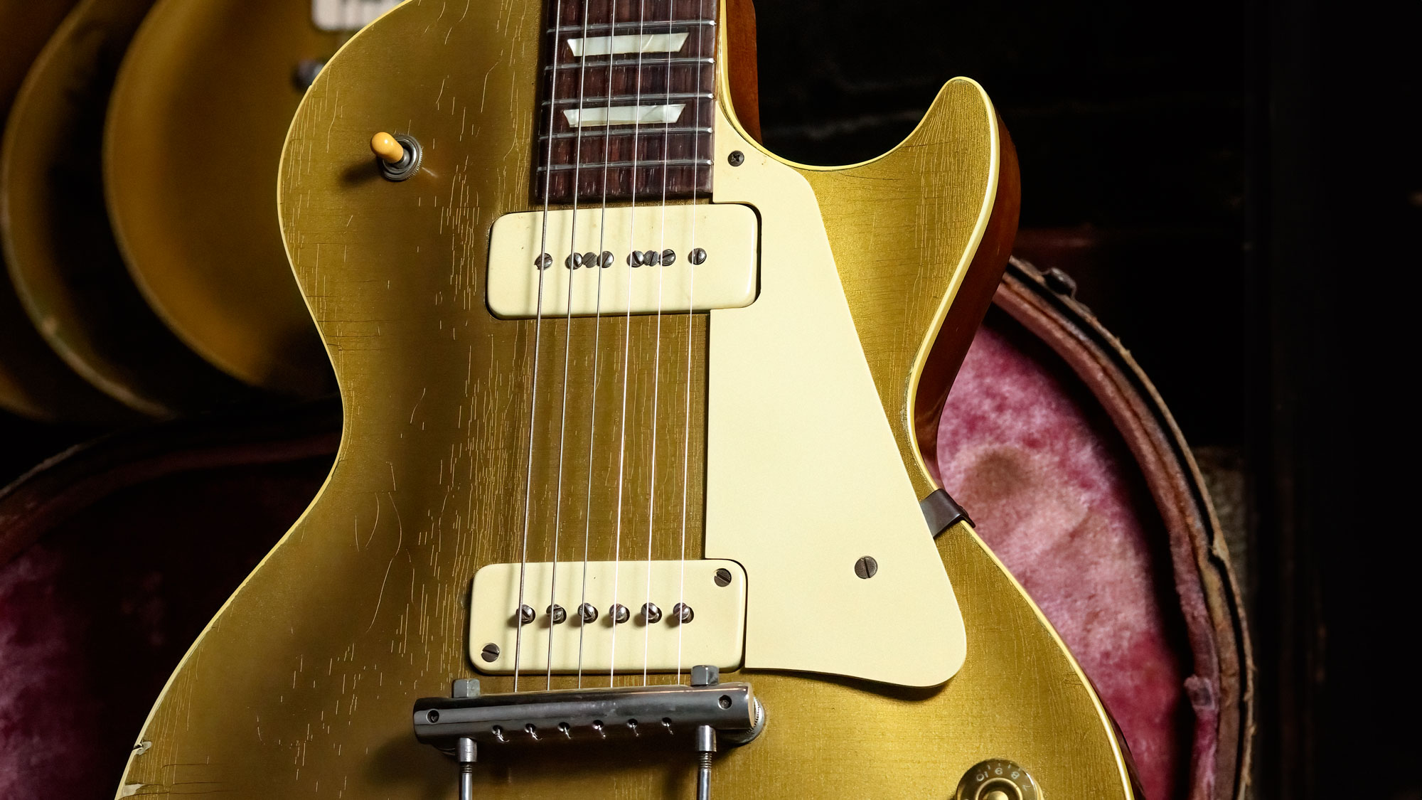 1952 Gibson Les Paul Goldtop pictured in a vintage guitar case.
