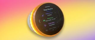 The Ambient Dreamie Bedside Sleep Assistant and Smart Alarm Clock on an ombre pink and yellow background