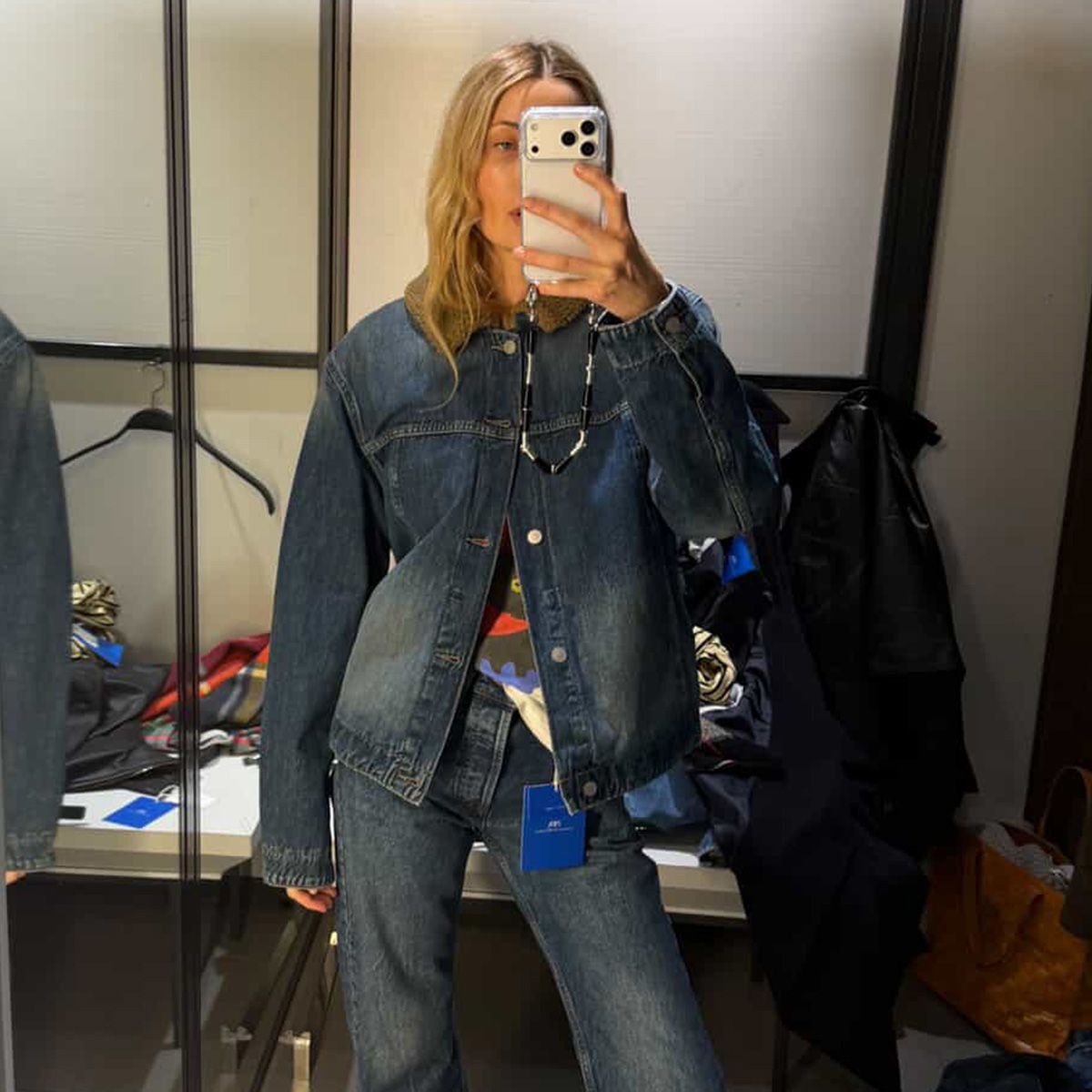 Courtney grows wears a denim jacket with the zara x aaron levine mens jeans.
