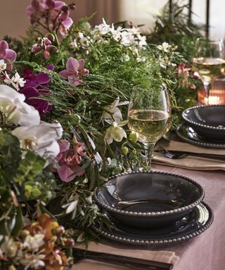 christmas table setting with flower centerpiece