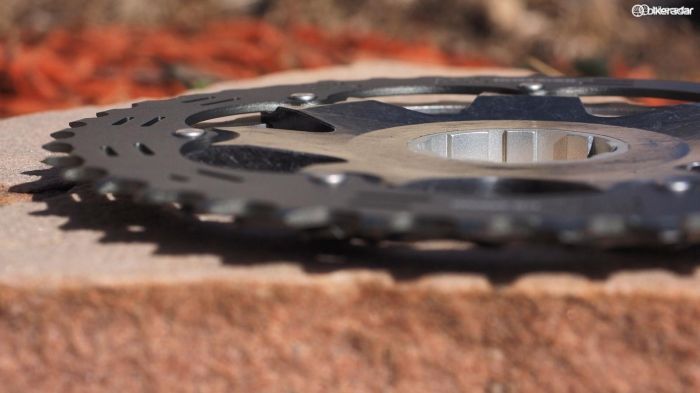How does Shimano cram 11 cogs on to a 10-speed freehub body? By taking advantage of the spoke angles on the driveside and cantilevering the biggest cog over the spoke flange