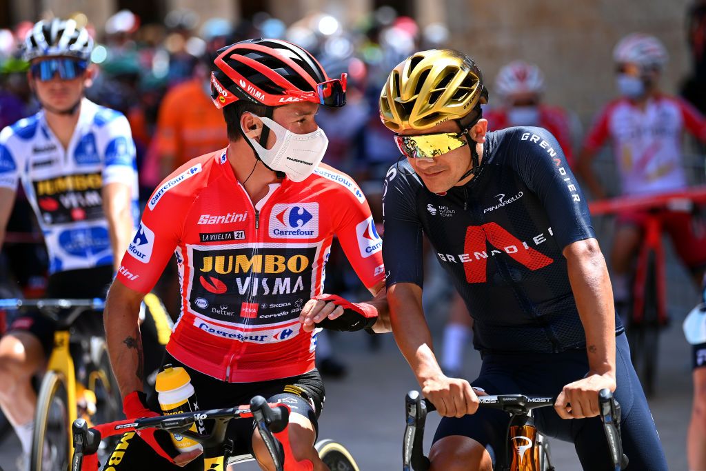 BURGOS SPAIN AUGUST 15 LR Primoz Roglic of Slovenia and Team Jumbo Visma red leader jersey and Richard Carapaz of Ecuador and Team INEOS Grenadiers winner of Olympic road race prepare for the race prior to the 76th Tour of Spain 2021 Stage 2 a 1667km stage from Caleruega Monasterio de Santo Domingo de Guzmn to Burgos Gamonal lavuelta LaVuelta21 CapitalMundialdelCiclismo on August 15 2021 in Burgos Spain Photo by Stuart FranklinGetty Images