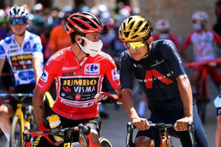 BURGOS SPAIN AUGUST 15 LR Primoz Roglic of Slovenia and Team Jumbo Visma red leader jersey and Richard Carapaz of Ecuador and Team INEOS Grenadiers winner of Olympic road race prepare for the race prior to the 76th Tour of Spain 2021 Stage 2 a 1667km stage from Caleruega Monasterio de Santo Domingo de Guzmn to Burgos Gamonal lavuelta LaVuelta21 CapitalMundialdelCiclismo on August 15 2021 in Burgos Spain Photo by Stuart FranklinGetty Images