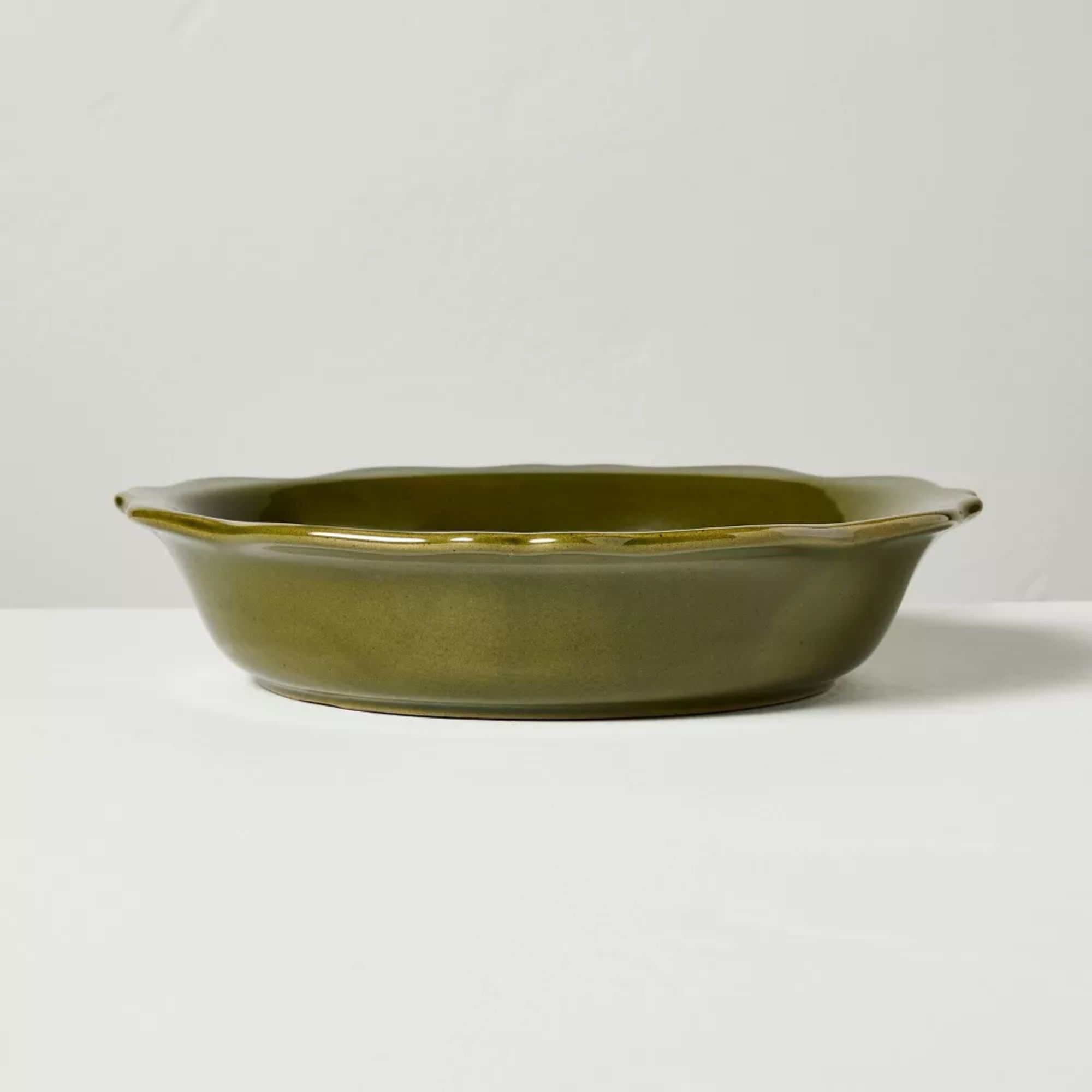 Moss green stone pasta bowl with scalloped edges
