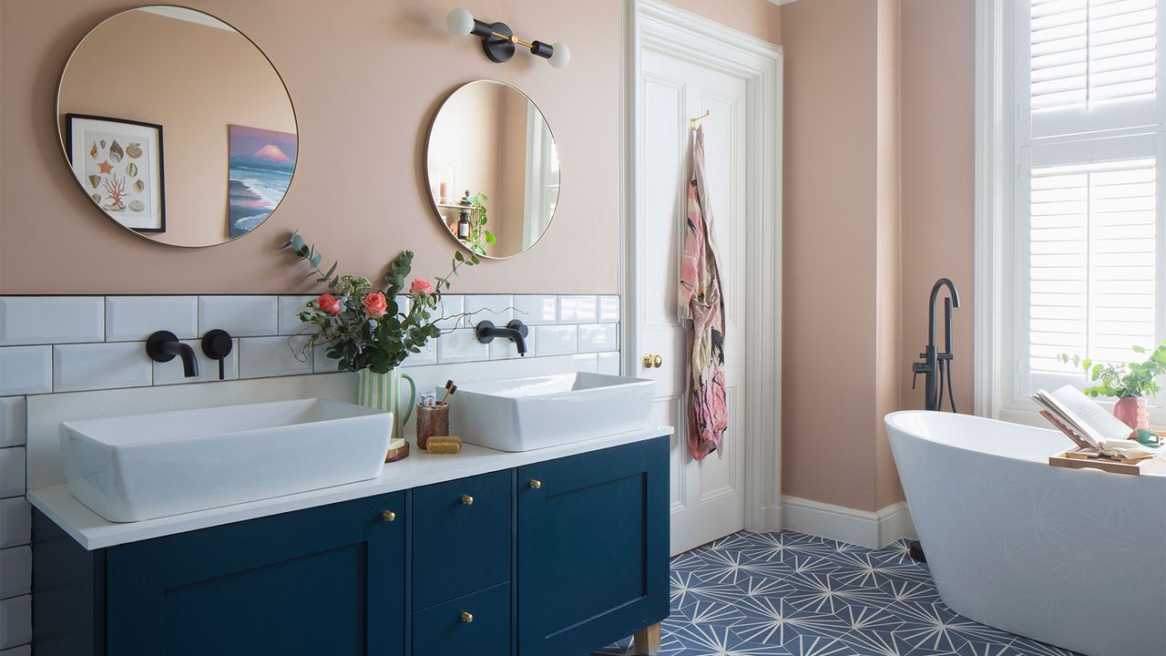 peach and blue bathroom with vanity unit