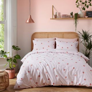 bedroom with pink quilt
