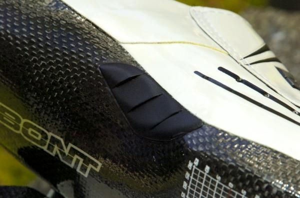 Though light and stiff, the handbuilt construction also leaves visible glue lines and raw-looking edges