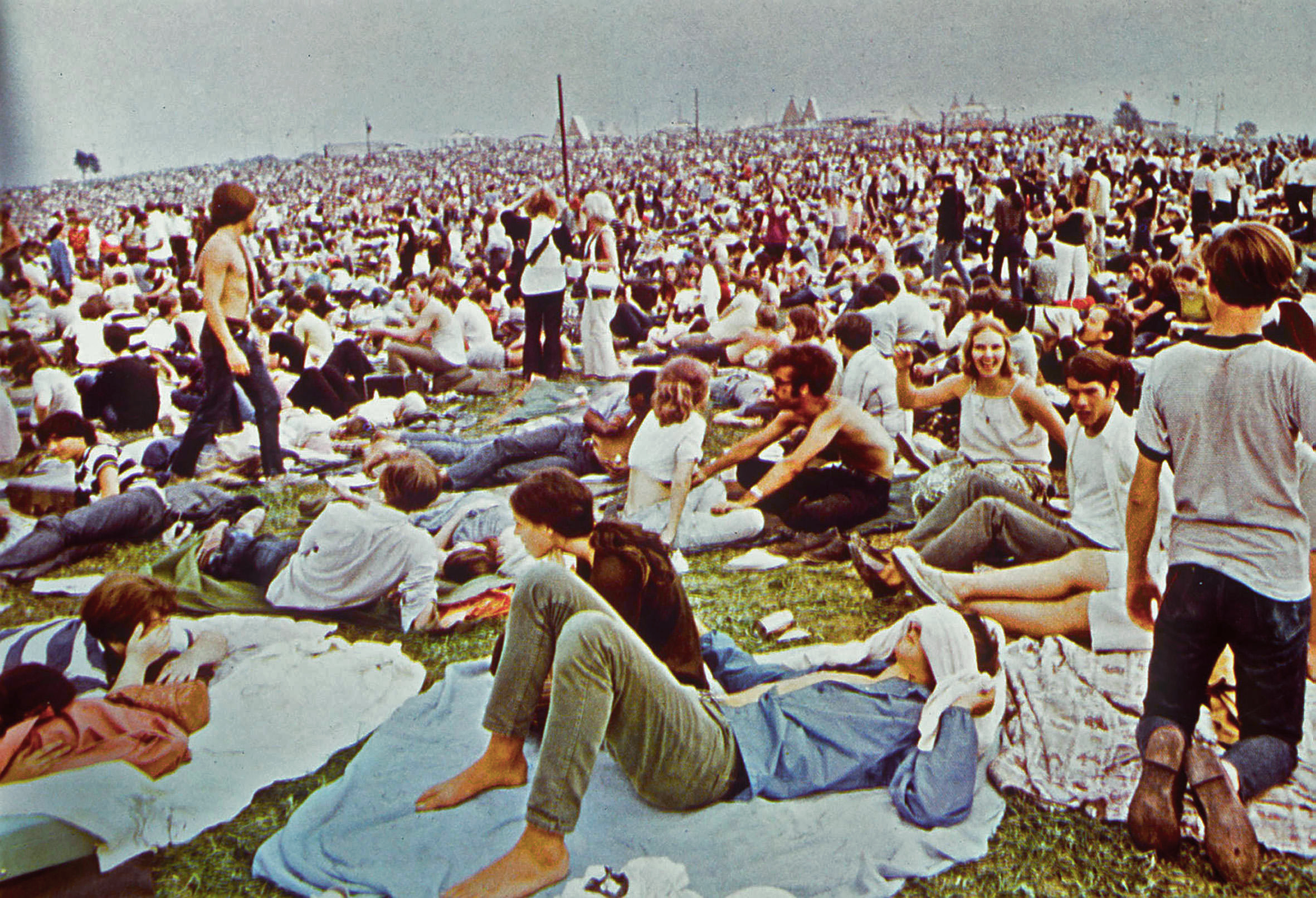 A scene of crowds at the 1969 Woodstock festival taken from the D.A. Pennebaker film of the event