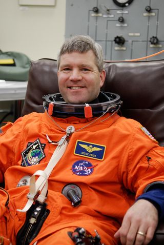 Steve Frick is happy to be suiting up for launch of space shuttle Atlantis on the STS-122 mission.