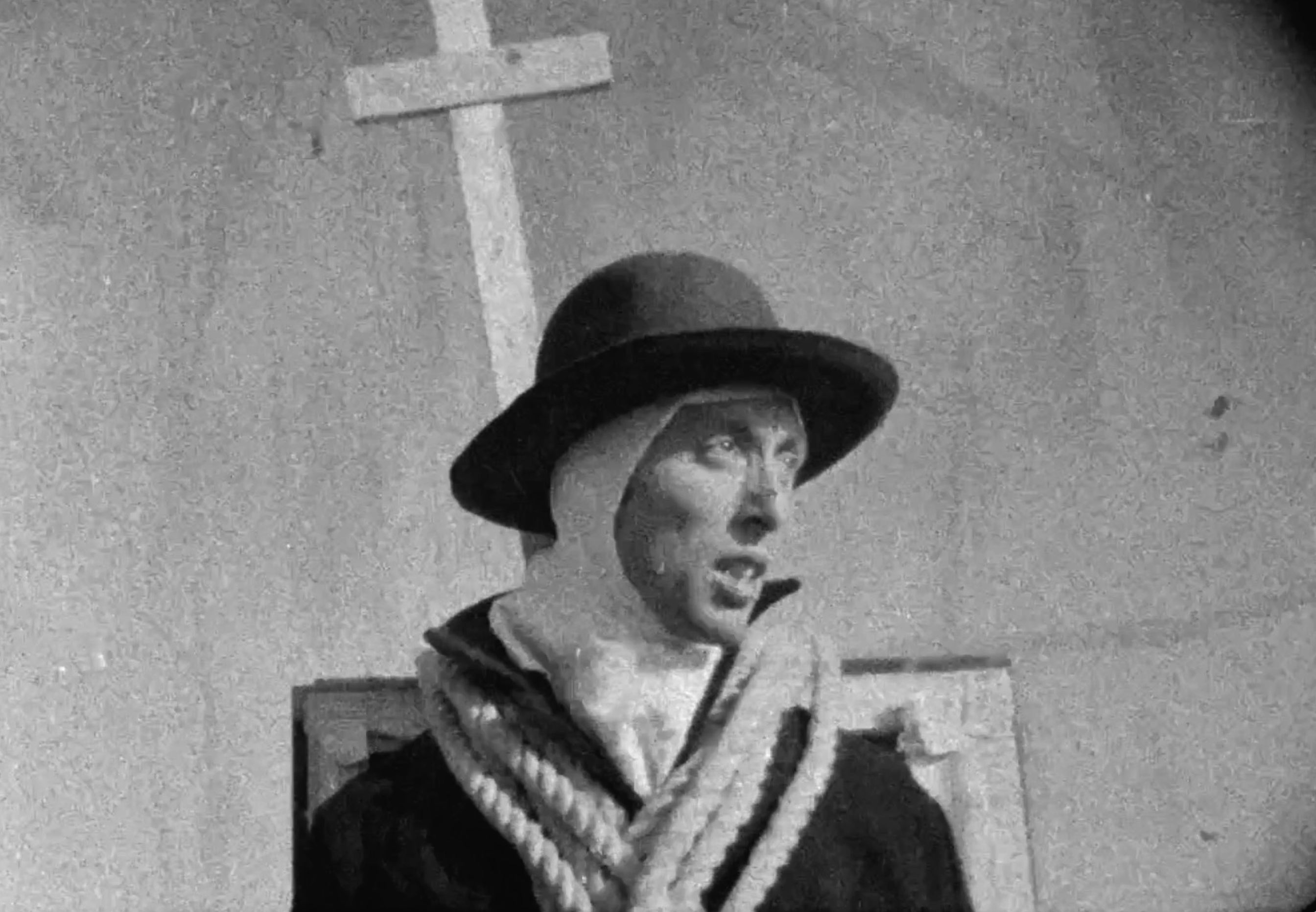 man in hat in front of cross, from New Contemporaries&amp;rsquo; exhibition of emerging artists