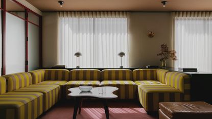 A striped yellow and grey sofa