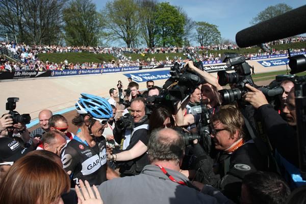Johan Van Summeren (Garmin-Cerv&eacute;lo) gets swamped by the media after winning Paris-Roubaix.