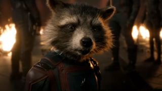 Rocket stands defiantly while surrounded by friends and fire in Guardians of the Galaxy: Vol 3.