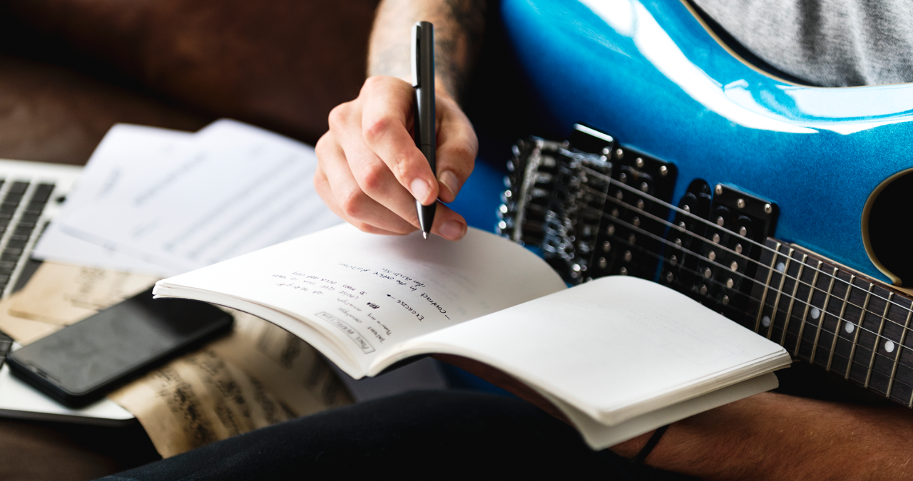 Songwriter with guitar