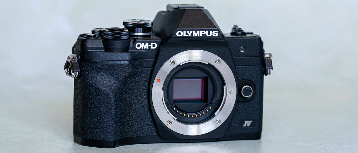 Olympus OM-D E-M10 Mark IV on a plain background