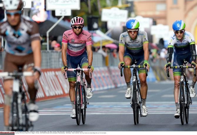 Orica-GreenEdge cross the line with Michael Matthews still in pink