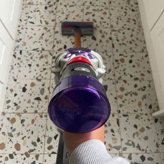 Using the Dyson V8 Absolute on terrazzo-tiled kitchen floor