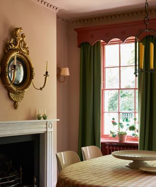 unexpected red curtain pelmet in pink dining room