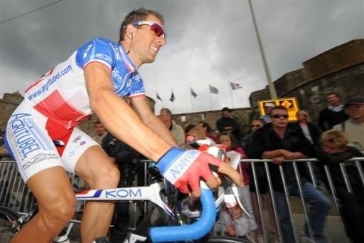 French champion Nicolas Vogondy (Agritubel) makes his way to the start beneath threatening skies.